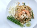 Pad Thai, stir-fried rice noodles with shrimp in white dish on white background. The one of Thailand's national main dish. th Royalty Free Stock Photo