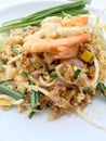 Pad Thai, stir-fried rice noodles with shrimp in white dish on white background. The one of Thailand's national main dish. th Royalty Free Stock Photo