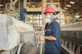 Zinc mine. Engineer cleaning machine in factory.