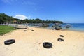 Padang Bai beach with traditional outrigger boats in Bali, Indonesia.