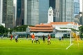 Foot ball activity on Padang field, with Singapore Cricket Club in the background Royalty Free Stock Photo