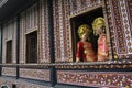 Local tourists wear traditional Minangkabau women's clothing in the historic building of Rumah Gadang