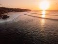 Padang Padang surf spot at sunset with ideal swell waves Royalty Free Stock Photo