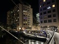 Paddington Basin with restaurants and boats and its surrounding area by night, London. Royalty Free Stock Photo