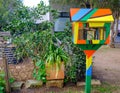 Bright colourful fun street Little Library for giving away and swapping free books