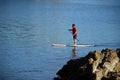 Paddle boarder on Crescent Bay, Laguna Beach, California.