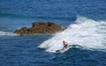 Standup paddle boarder surfing off Heisler Park, Laguna Beach, California.