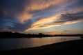 Paddle boarders on lake at sunset in West Texas Royalty Free Stock Photo