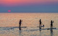 Paddle boarders at sunrise Royalty Free Stock Photo