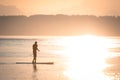 Paddle Boarding Silhouette at Sunset Royalty Free Stock Photo