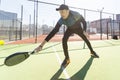 paddle tennis coach teaching on a residential paddle court, front view