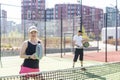 paddle tennis couple players ready for class