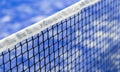 Paddle tennis and tennis net on blue court. Tennis competion concept. Horizontal sport poster, greeting cards, headers, website