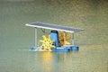 Paddle wheel aerator using solar energy panel Royalty Free Stock Photo