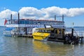 Two tourist boats on Lake Rotorua, New Zealand, a paddlewheeler and a water taxi