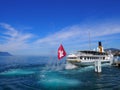 Paddle-wheel steam boat sails away in Montreux city in Switzerland