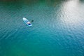 Paddleboard SUP Man having fun paddle board in Hawaii. Fitness recreational leisure activity. Beach rental equipment on