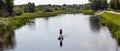 Paddleboarding on lake, aerial view. Stand up paddle boarding (SUP) water sport