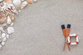 Paddles and life buoy lying on a sand Royalty Free Stock Photo