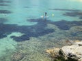 Paddelsurf in the mediterranean sea, crystal-clear waters of Costa Brava, Catalonia, Spain