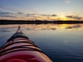 Paddling towards sunset, absolutely calm water in Stocksjo Lake, close to Umea City, Vasterbotten County, Northern Sweden. No