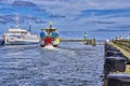 Paddlwheel steamboat painted in old-fashioned, and blue reflects on the waters of a swamp. WarnemÃÂ¼nde Royalty Free Stock Photo