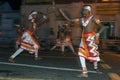 Paddy Dancers perform along the streets of Kandy in Sri Lanka during the Esala Perahera.