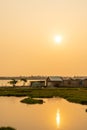 Paddy field in sunset time. Asian countryside landscape. Rural village scenery