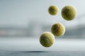 Padel balls in dynamic motion blur crossing the frame with three in sharp focus, set against a neutral court background, Royalty Free Stock Photo