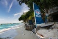 PADI SCUBA dive shop logo flag at beautiful Thailand travel island `Koh Lipe` with white sand beach and turquoise sea water landsc