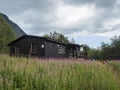 Padjelanta, Norrbotten, Sweden, Agust 15, 2021: View of STF Tarrekaise Mountain cabin on a flowering meadow on the banks