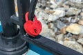 A padlock attached to the railing of the bridge as a symbol of family marriage