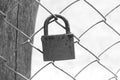 Padlock on background of lattice fence