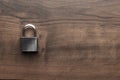 Padlock on the brown wooden table with copy space Royalty Free Stock Photo