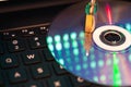 Padlock on cd disc, reflection of the laptop data monitor.