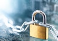 Padlock with chain on electronic printed circuit board. IT, internet protection, computer safety. Network Security, data security Royalty Free Stock Photo