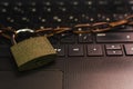 Padlock with chain on laptop keyboard Royalty Free Stock Photo