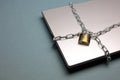 A padlock and chain around a laptop Royalty Free Stock Photo