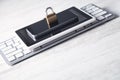 Padlock with computer keyboard, smartphone and tablet. Internet and technology security Royalty Free Stock Photo