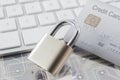 Padlock and credit card on keyboard and electronic circuits Royalty Free Stock Photo