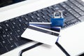 Padlock and credit cards on the computer keyboard. Credit card security Royalty Free Stock Photo