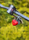 Padlock in form heart on bridge, symbol of love. Royalty Free Stock Photo