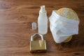 Padlock with globe , hand sanitizer and face mask