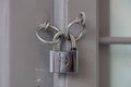 Padlock on grey wooden door close up, closed secured house entrance. Traditional door detail Royalty Free Stock Photo