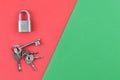 Padlock and keys over red and green background with copy space Royalty Free Stock Photo