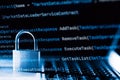 Padlock on laptop with a programming language. Internet data privacy information security concept. Antivirus and malware defense