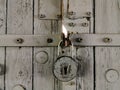 Padlock lock on wooden gates background. The padlock is open Royalty Free Stock Photo