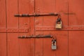 Old padlock locking the wooden door