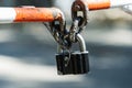 Padlock on a metal barrier. Closed area for unauthorized persons. Close-up Royalty Free Stock Photo