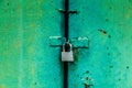 Padlock on the green metal door Royalty Free Stock Photo